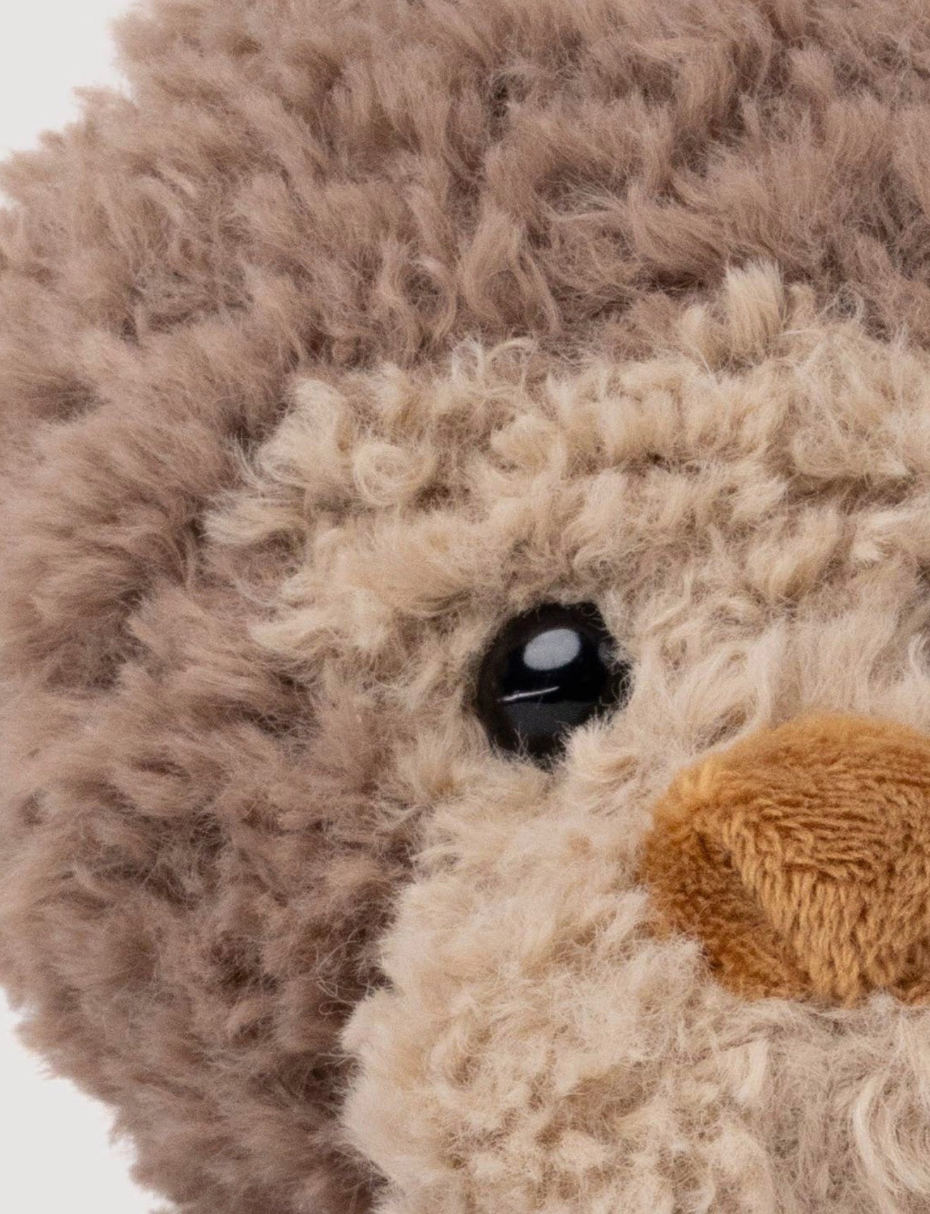Close-up van het oog van de Retro Vrienden Aap knuffel
