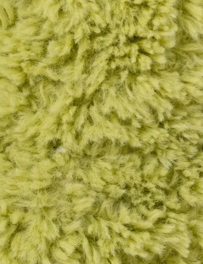 Close-up van de limoengroene vacht van de Retro Vrienden Kikker knuffel