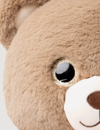 Close-up van het glinsterende oog en de snuit van de Sumo Teddy knuffel